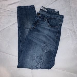 Edgy, mid-rise covered-hole ripped KanCan jeans